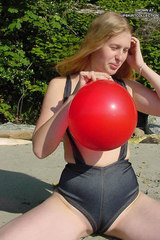 Voluptuous blonde's big beach cameltoe